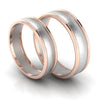 Perspective View of Classic Plain Platinum Couple Rings With a Rose Gold Border JL PT 633
